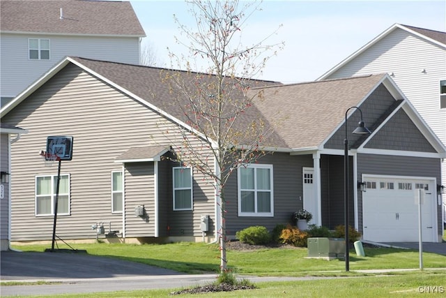 522 Chenango Hill Dr, Hamilton, NY 13346 - view of front facade with a front lawn, an attached garage, driveway, and roof with shingles