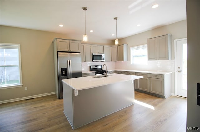 522 Chenango Hill Dr, Hamilton, NY 13346 - kitchen featuring appliances with stainless steel finishes, a sink, gray cabinetry, backsplash, and recessed lighting