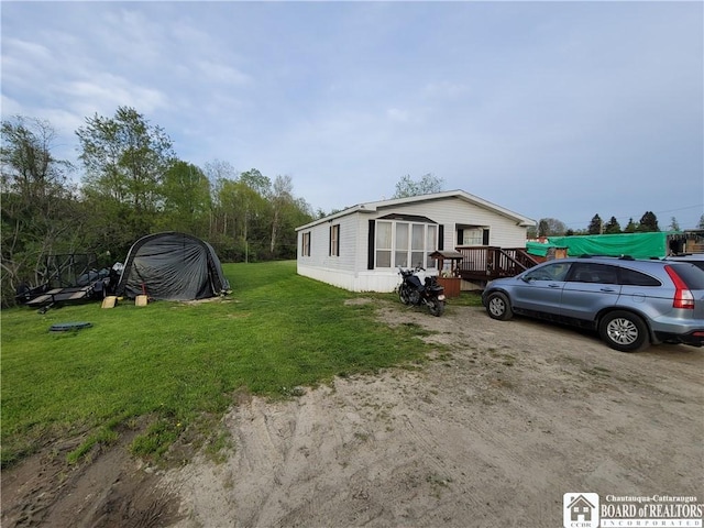 584 Warren Rd, Carroll, NY 14738 - view of property exterior featuring a lawn