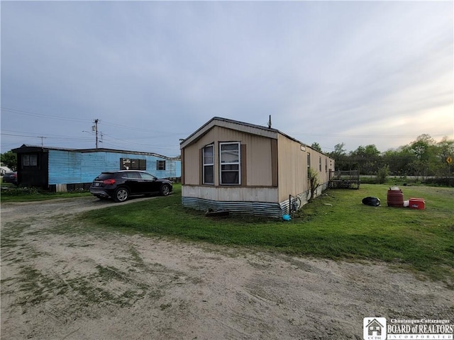 584 Warren Rd, Carroll, NY 14738 - view of side of property with a lawn