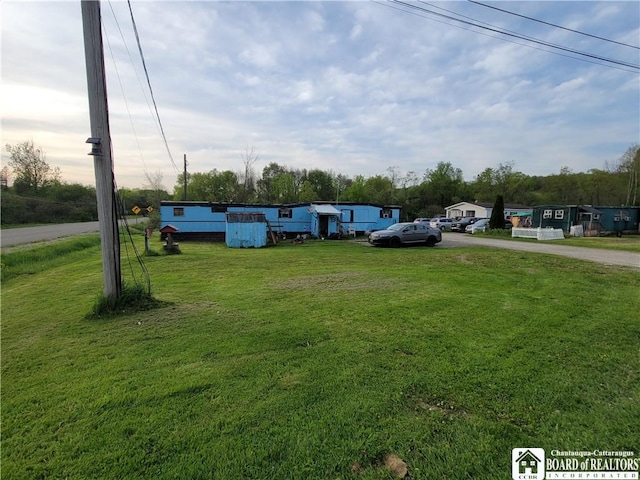 584 Warren Rd, Carroll, NY 14738 - view of grassy yard with driveway