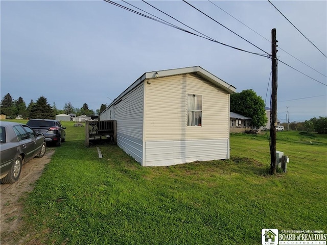 584 Warren Rd, Carroll, NY 14738 - view of home's exterior featuring a lawn