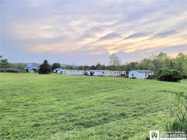 584 Warren Rd, Carroll, NY 14738 - yard at dusk with a yard and a view of rural / pastoral area
