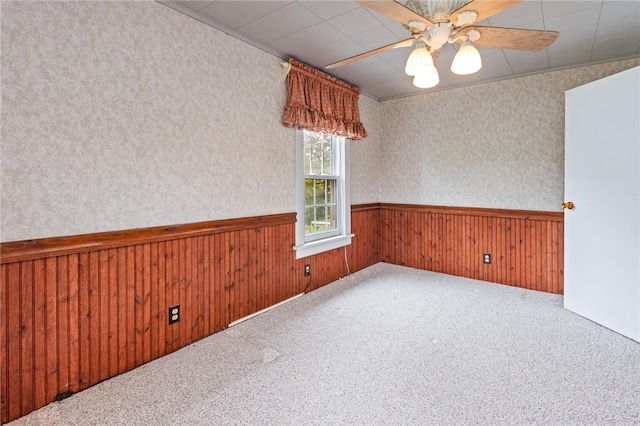 187 Clark St, Canandaigua-City, NY 14424 - empty room featuring wainscoting, ceiling fan, carpet flooring, wooden walls, and wallpapered walls