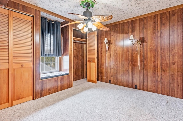 187 Clark St, Canandaigua-City, NY 14424 - carpeted spare room with wooden walls and a ceiling fan