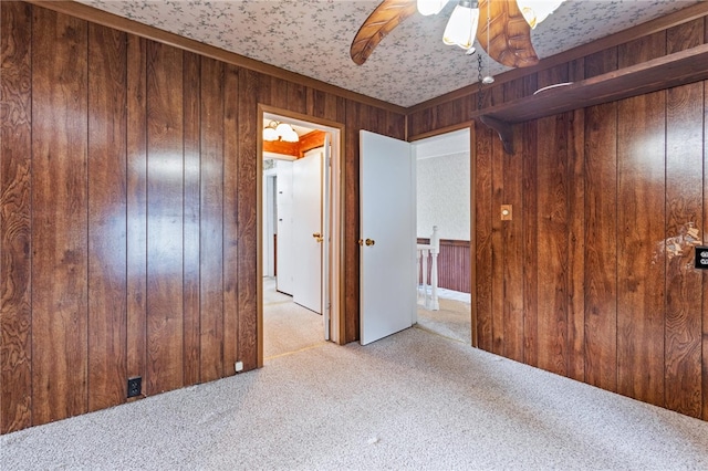187 Clark St, Canandaigua-City, NY 14424 - carpeted empty room featuring wooden walls and ceiling fan