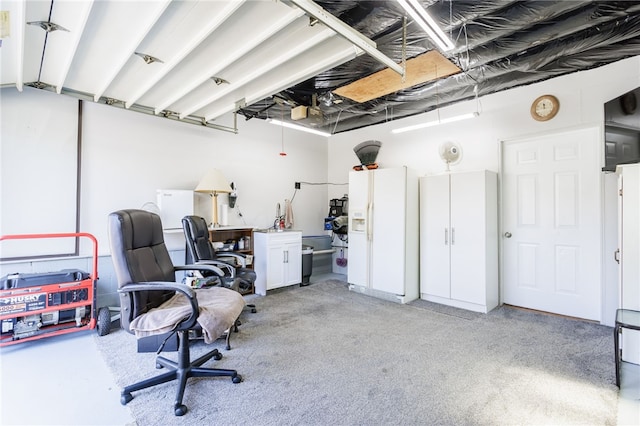 garage with white fridge with ice dispenser and an office area