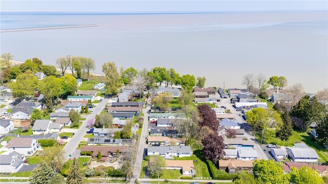 aerial view of residential area with a large body of water