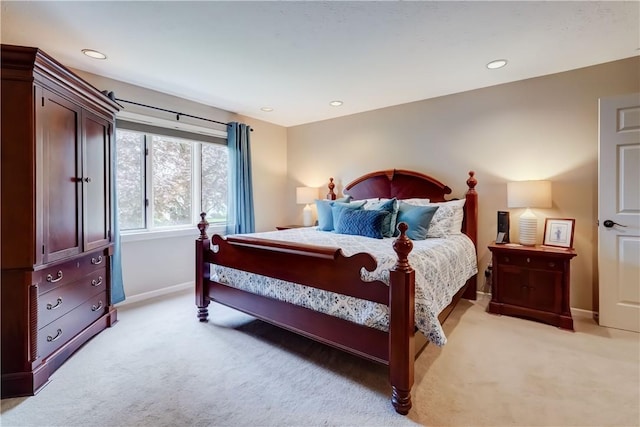 bedroom featuring light colored carpet, baseboards, and recessed lighting