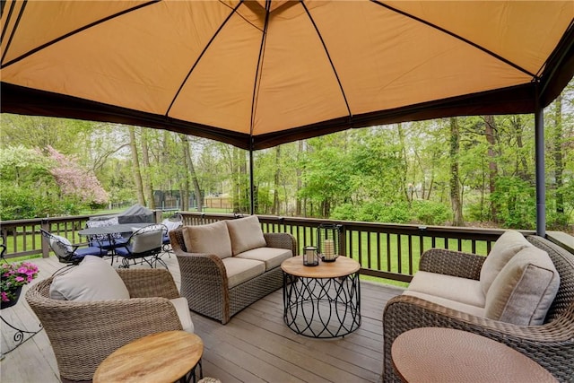 wooden terrace featuring an outdoor living space and outdoor dining space