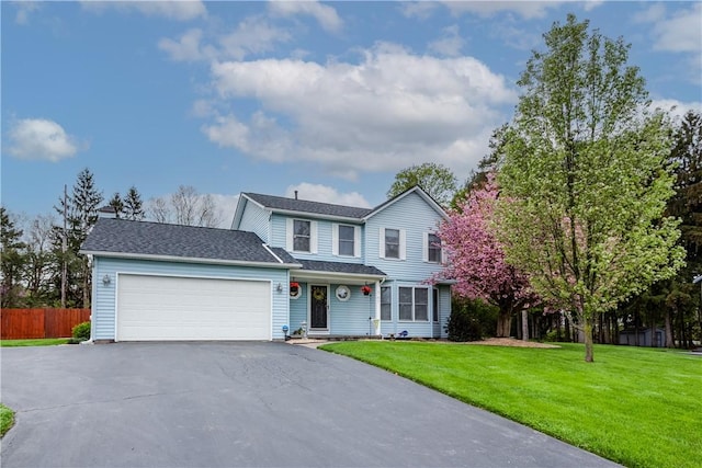 traditional home with driveway and a garage