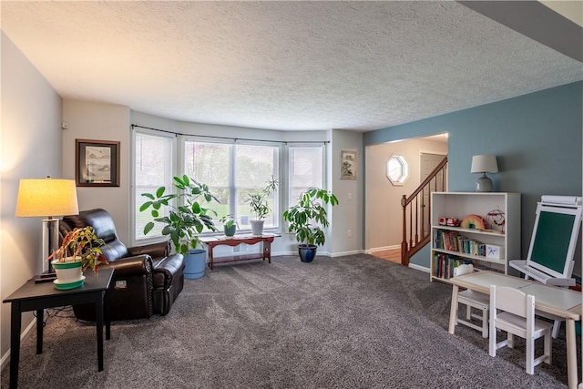 living area featuring carpet floors, a textured ceiling, baseboards, stairs, and an office area