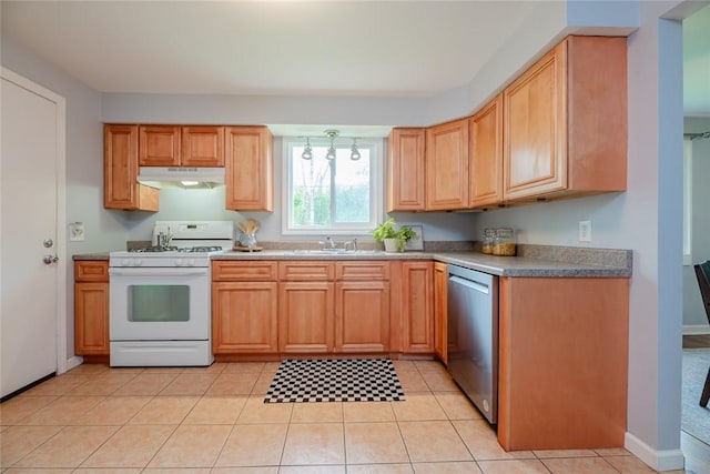 kitchen featuring white gas stove, dishwasher, under cabinet range hood, a sink, and light tile patterned floors