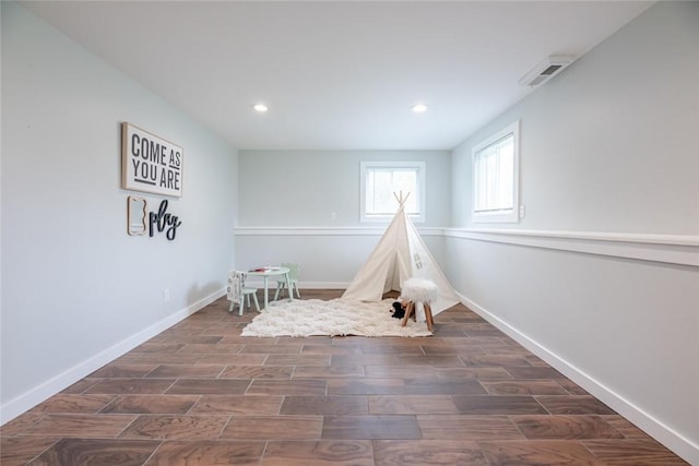 playroom featuring wood finished floors, recessed lighting, and baseboards