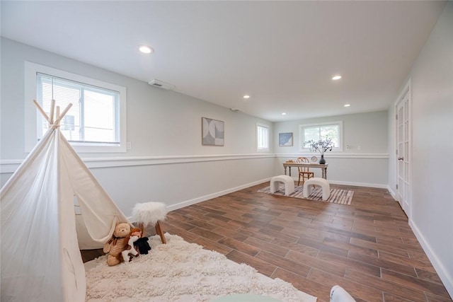 game room featuring wood finished floors, recessed lighting, and baseboards
