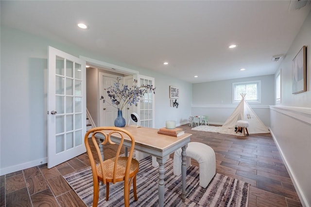 dining space featuring baseboards and recessed lighting