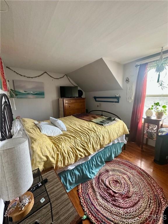 923 Teall Ave, Syracuse, NY 13206 - bedroom with wood finished floors and lofted ceiling