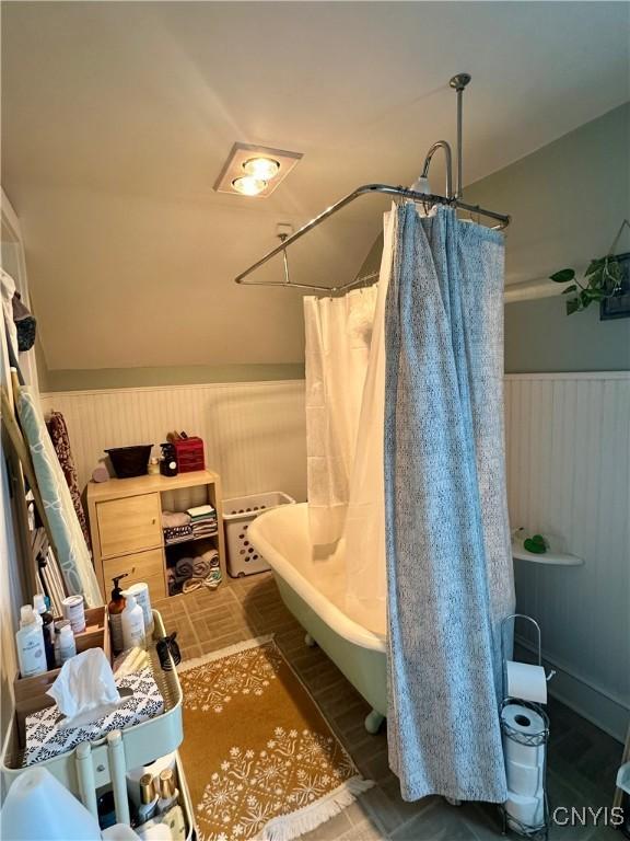 923 Teall Ave, Syracuse, NY 13206 - full bath with a shower with curtain, a wainscoted wall, and a tub