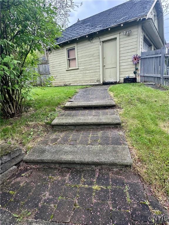 923 Teall Ave, Syracuse, NY 13206 - doorway to property featuring a shingled roof