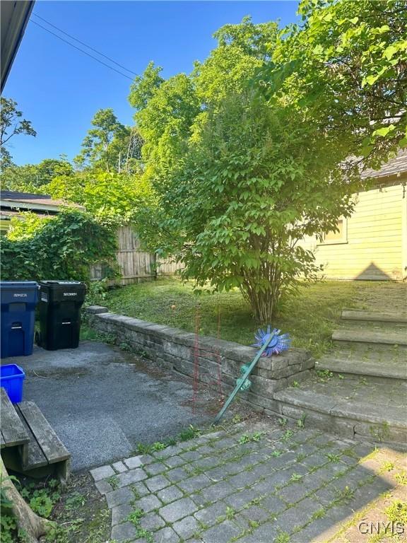 923 Teall Ave, Syracuse, NY 13206 - fenced yard with a patio area
