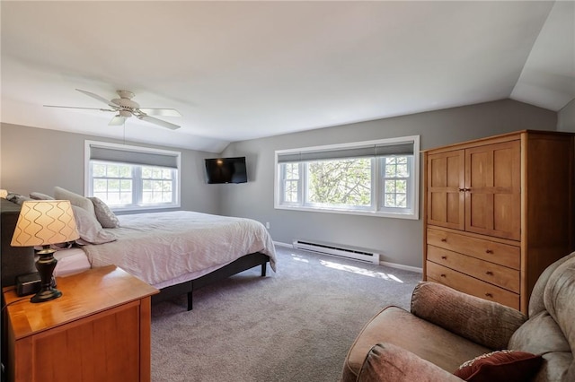 carpeted bedroom featuring baseboard heating, lofted ceiling, multiple windows, ceiling fan, and baseboards