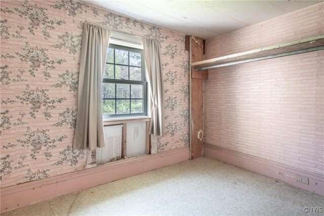 37931 State Route 12e, Clayton, NY 13624 - unfurnished room with wallpapered walls
