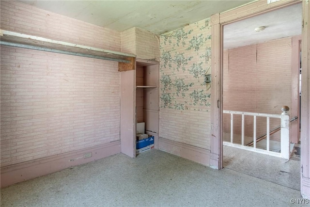 37931 State Route 12e, Clayton, NY 13624 - unfurnished bedroom with brick wall
