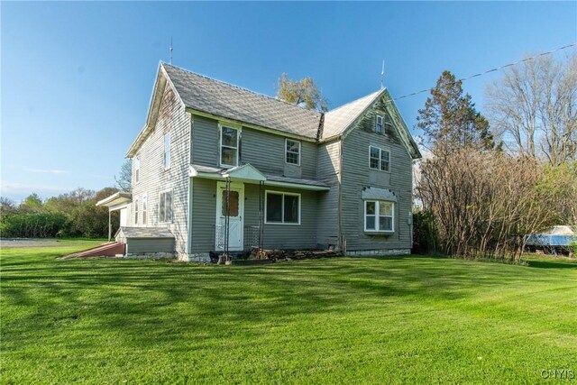 37931 State Route 12e, Clayton, NY 13624 - rear view of house featuring a yard