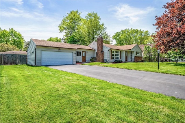 single story home featuring driveway, an attached garage, and a chimney