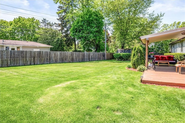 view of yard featuring a deck and an outdoor hangout area