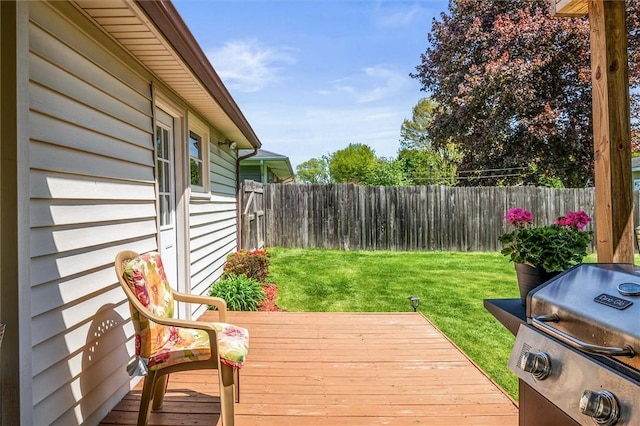 wooden terrace featuring a grill