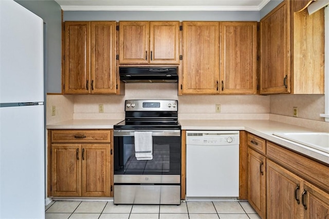 kitchen featuring white appliances, ventilation hood, light countertops, brown cabinetry, and crown molding