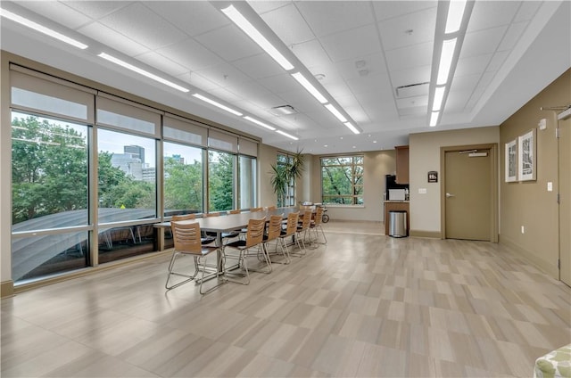 132 Lakefront Blvd Unit 104, Buffalo, NY 14202 - dining room with baseboards and a drop ceiling