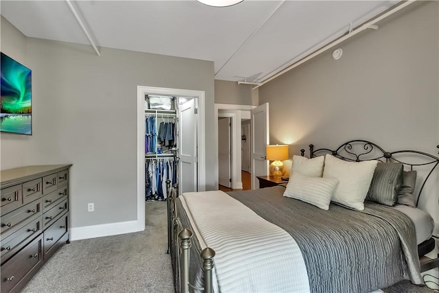 132 Lakefront Blvd Unit 104, Buffalo, NY 14202 - bedroom with a walk in closet, carpet floors, a closet, and baseboards