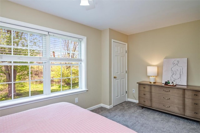 bedroom featuring carpet floors, baseboards, and a ceiling fan