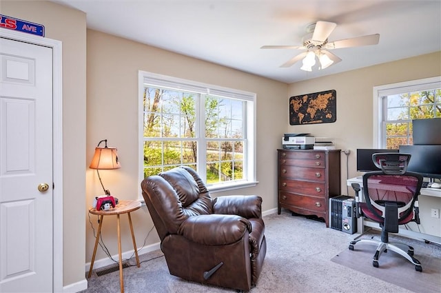 office area featuring baseboards, ceiling fan, and carpet floors