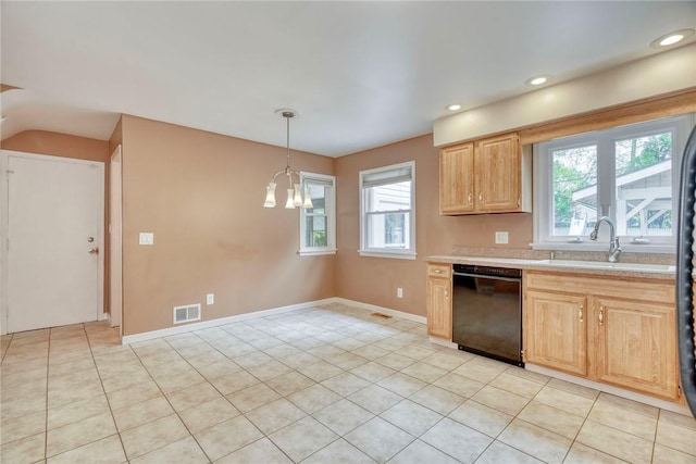 kitchen featuring black dishwasher, a sink, light countertops, light brown cabinetry, and a chandelier