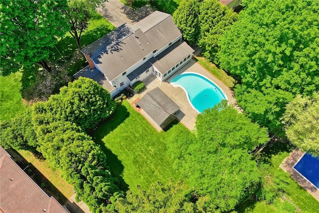 view of subject property featuring a pool area