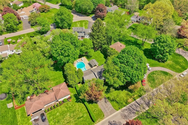 aerial view of residential area featuring a pool
