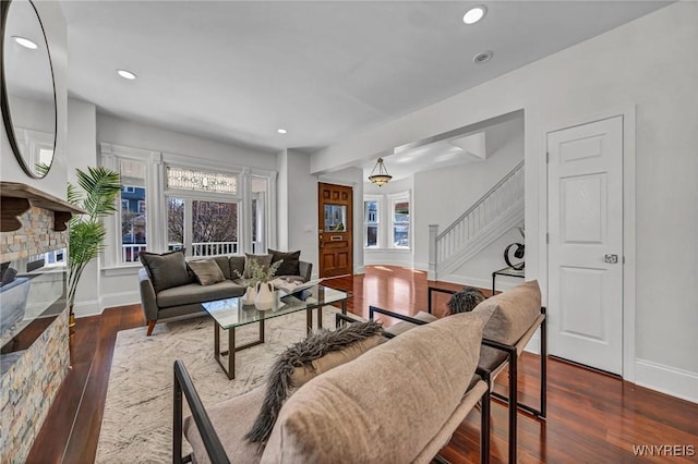 656 Auburn Ave, Buffalo, NY 14222 - living room with stairway, baseboards, dark wood-style flooring, recessed lighting, and a fireplace