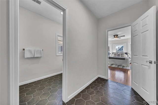 656 Auburn Ave, Buffalo, NY 14222 - hall with dark tile patterned flooring and baseboards