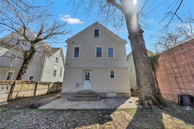 656 Auburn Ave, Buffalo, NY 14222 - back of property featuring a fenced backyard and a patio area