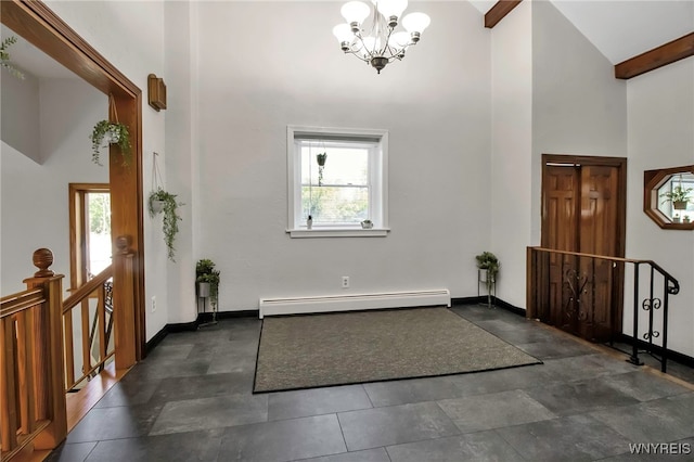 foyer entrance featuring a baseboard radiator, a towering ceiling, healthy amount of natural light, a chandelier, and beamed ceiling