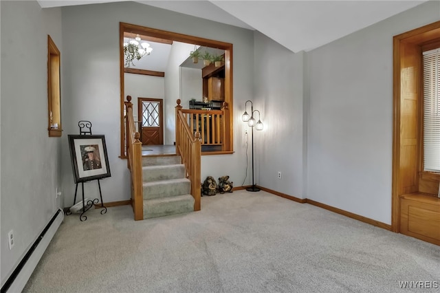 interior space featuring baseboard heating, carpet flooring, baseboards, and stairway