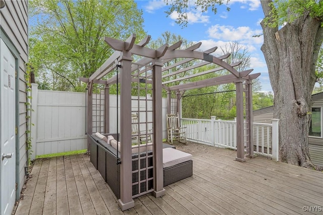 deck featuring a pergola and fence
