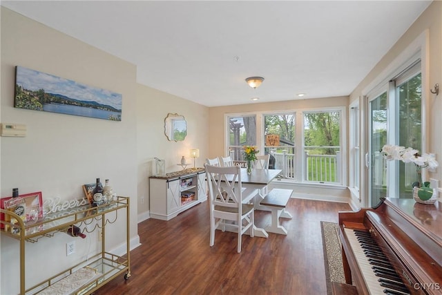 dining area with wood finished floors and baseboards