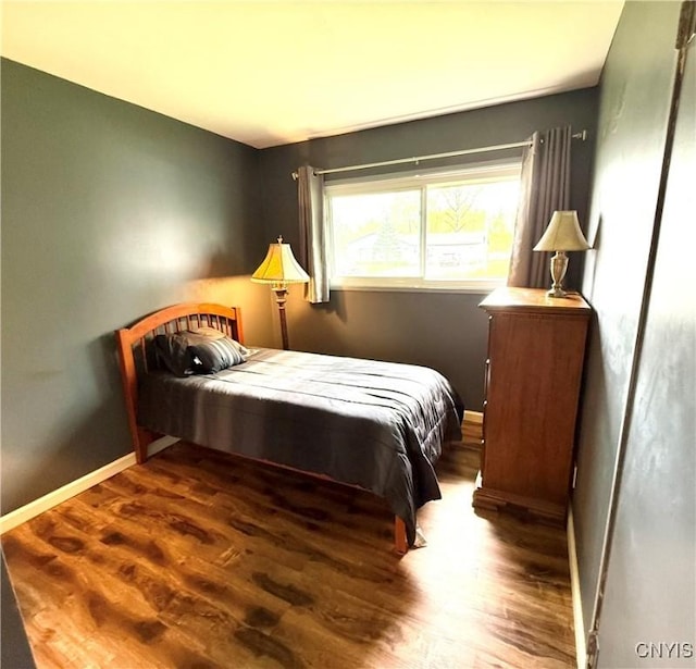 1004 W Thomas St, Rome-Inside, NY 13440 - bedroom with wood finished floors and baseboards