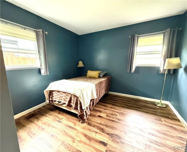 1004 W Thomas St, Rome-Inside, NY 13440 - bedroom with wood finished floors and baseboards