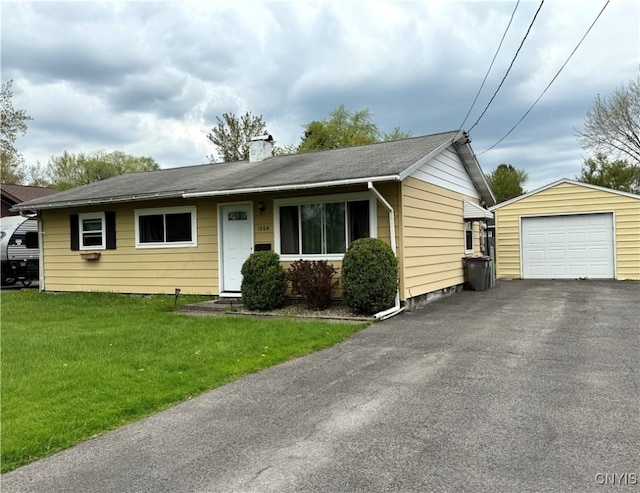 1004 W Thomas St, Rome-Inside, NY 13440 - view of front facade with an outbuilding, a detached garage, a chimney, a front yard, and asphalt driveway