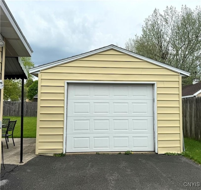 1004 W Thomas St, Rome-Inside, NY 13440 - detached garage with driveway and fence